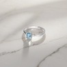Pierścionek srebrny z owalnym topazem swiss blue oraz cyrkoniami