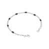 Bransoletka srebrna z drobnymi czarnymi koralikami na ozdobnym łańcuszku połączonym kuleczkami